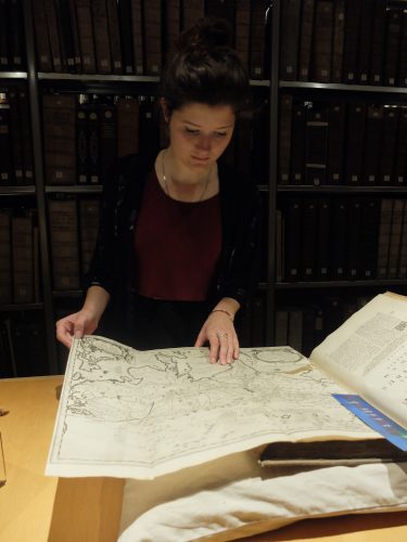 Samantha studies original maps from Kircher's China Illustrata. 