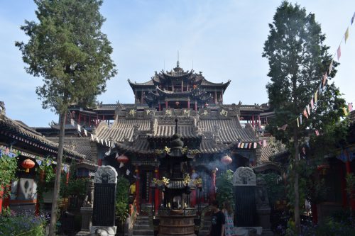 The Gao Miao Temple, surrounded by peaceful parks where locals relax and play music.