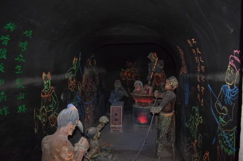 Scenes of Buddhist hell beneath the temple.