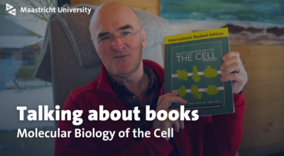 man showing book