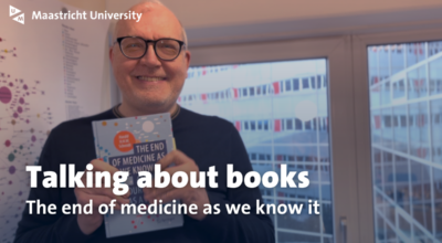 man holding book