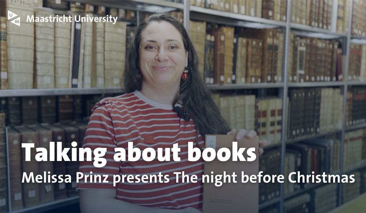 a woman in a library depot holding a book