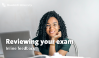 A student sitting behind her laptop to review her exam.