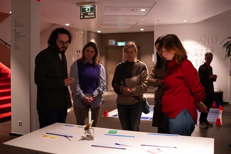 Maastricht University Library interior with students and staff.