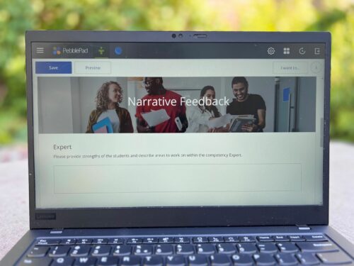 You see a laptop on a table with a PebblePad evaluation form on the screen.
