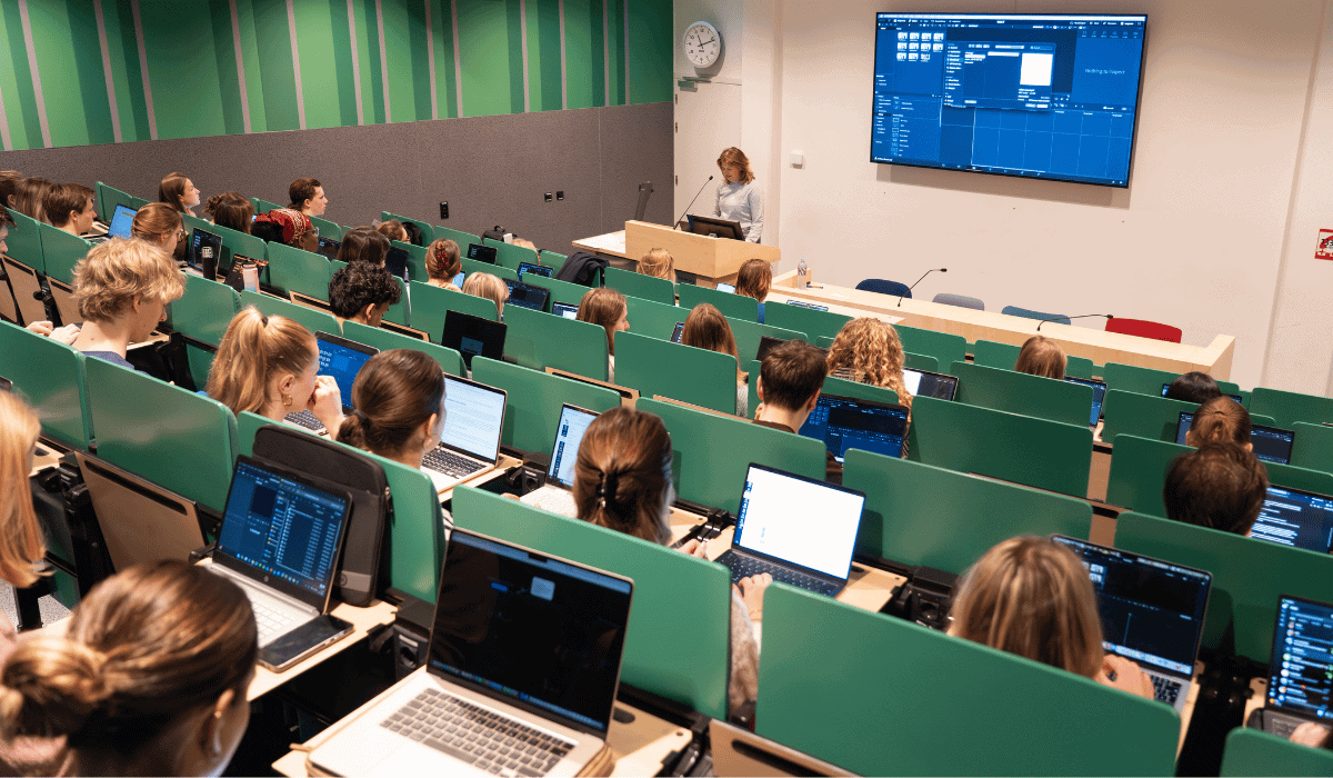 Students attending a research workshop in a university lecture hall.