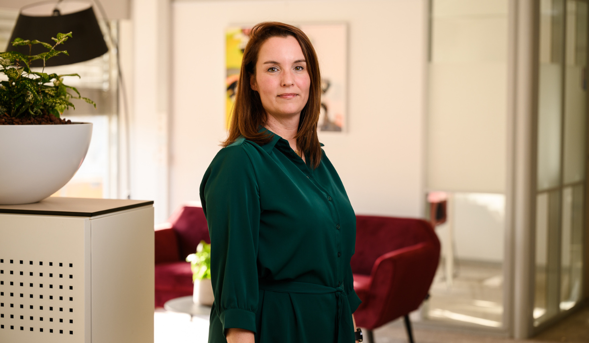 profile pic of a woman wearing a green dress