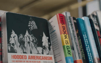 Hooded Americanism book on library shelf at Maastricht University Library.