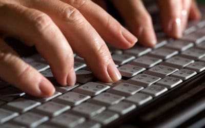 Female fingers typing on a keyboard