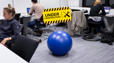 students in room with under construction sign