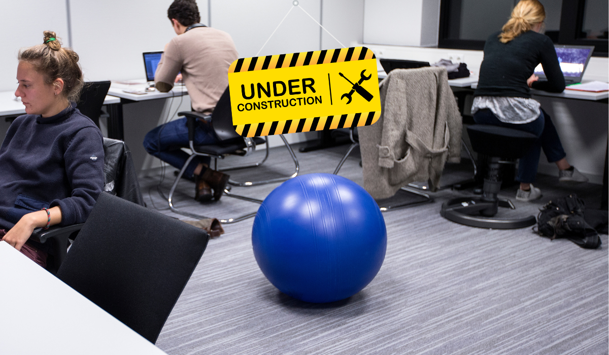 students in room with under construction sign