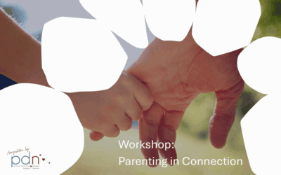 Child and adult holding hands symbolizing connection and positive discipline.