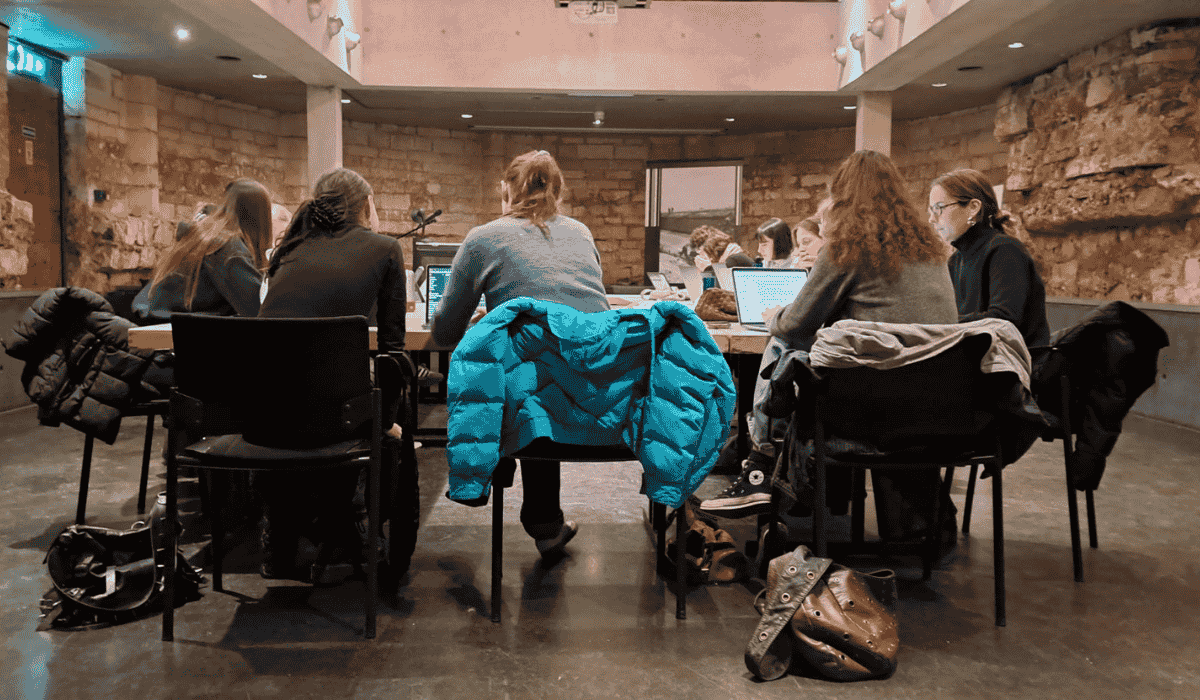 Medieval history students engaged in a class discussion at Maastricht University Library.