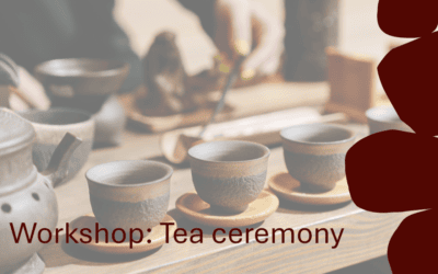Traditional Chinese tea ceremony with cups and teapot during workshop.
