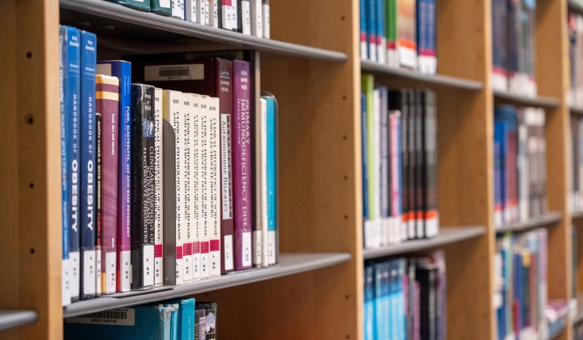 Interior view of bookshelves at Maastricht University Library.