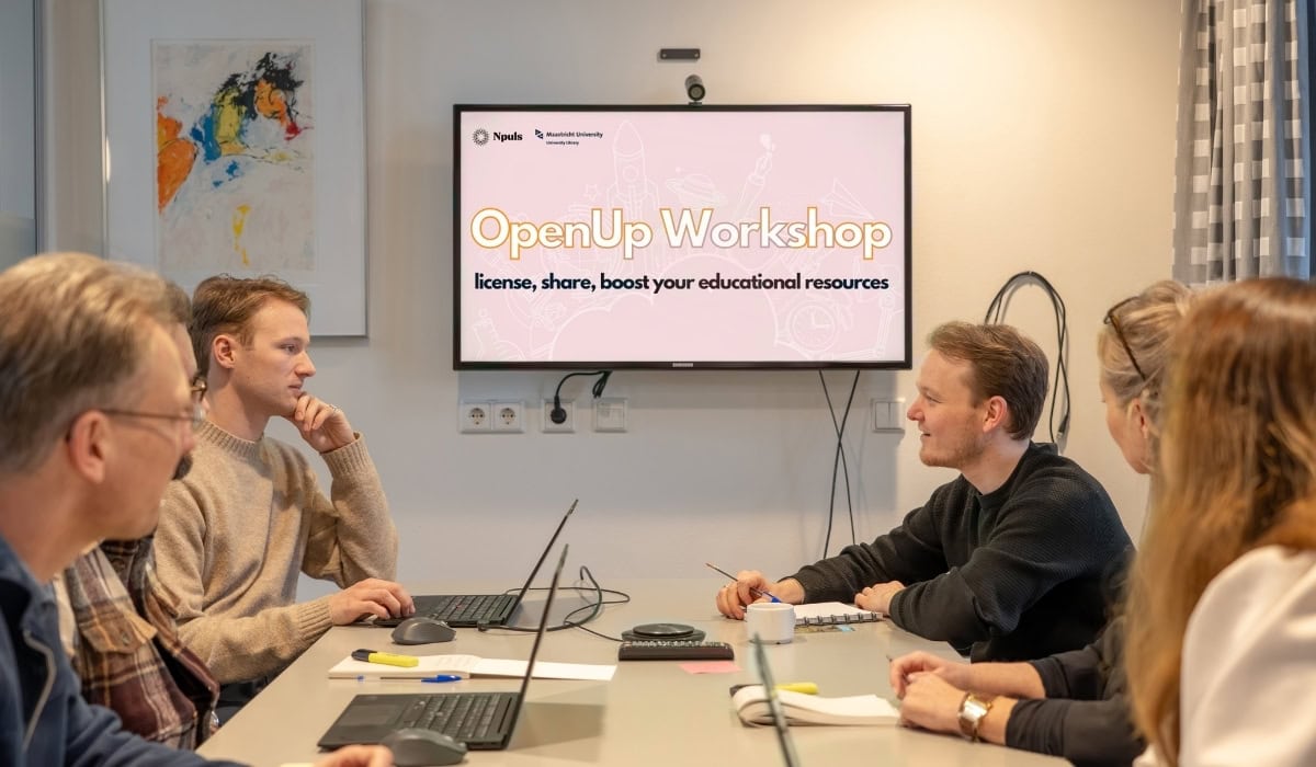 Group of students attending an OpenUp Workshop in a university meeting room.